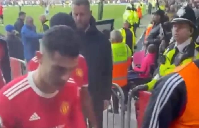 Cristiano Ronaldo pictured leaving the pitch at Everton's Goodison Park, where he was accused of smashing a fan's phone